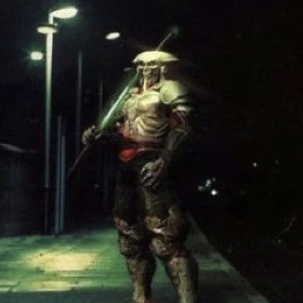 An armored knight standing on a train platform at night